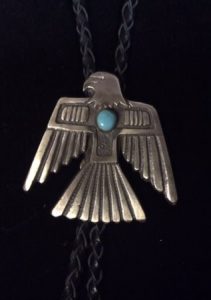 Sandcast sterling silver and turquoise thunderbird bolo tie by Navajo silversmith Eugene Mitchell
