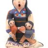 Jemez small seated storyteller figurine with two children and ball by Mary Lucero
