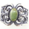 Navajo sandcast sterling silver and green turquoise cuff bracelet by Harrison BItsue