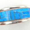 Zuni blue lab opal and sterling silver channel inlay cuff bracelet by Rickel and Glendora Booqua.