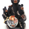 Jemez seated bear storyteller figurine with two cubs and pot of honey