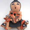 Jemez seated handmade and hand painted storyteller figurine with four children by Vernida Toya