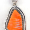 Navajo orange spiny oyster shell and sterling silver pendant by Walter Vandever