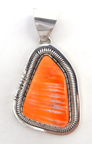 Navajo orange spiny oyster shell and sterling silver pendant by Walter Vandever