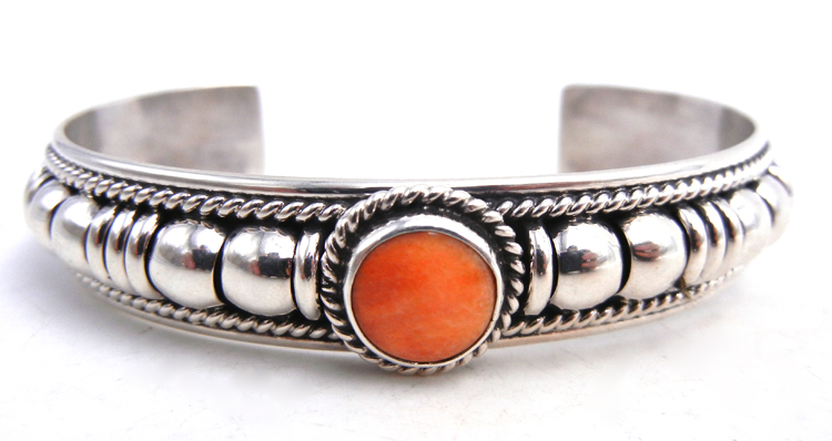 Navajo sterling silver and orange spiny oyster shell domed cuff bracelet by Thomas Charley