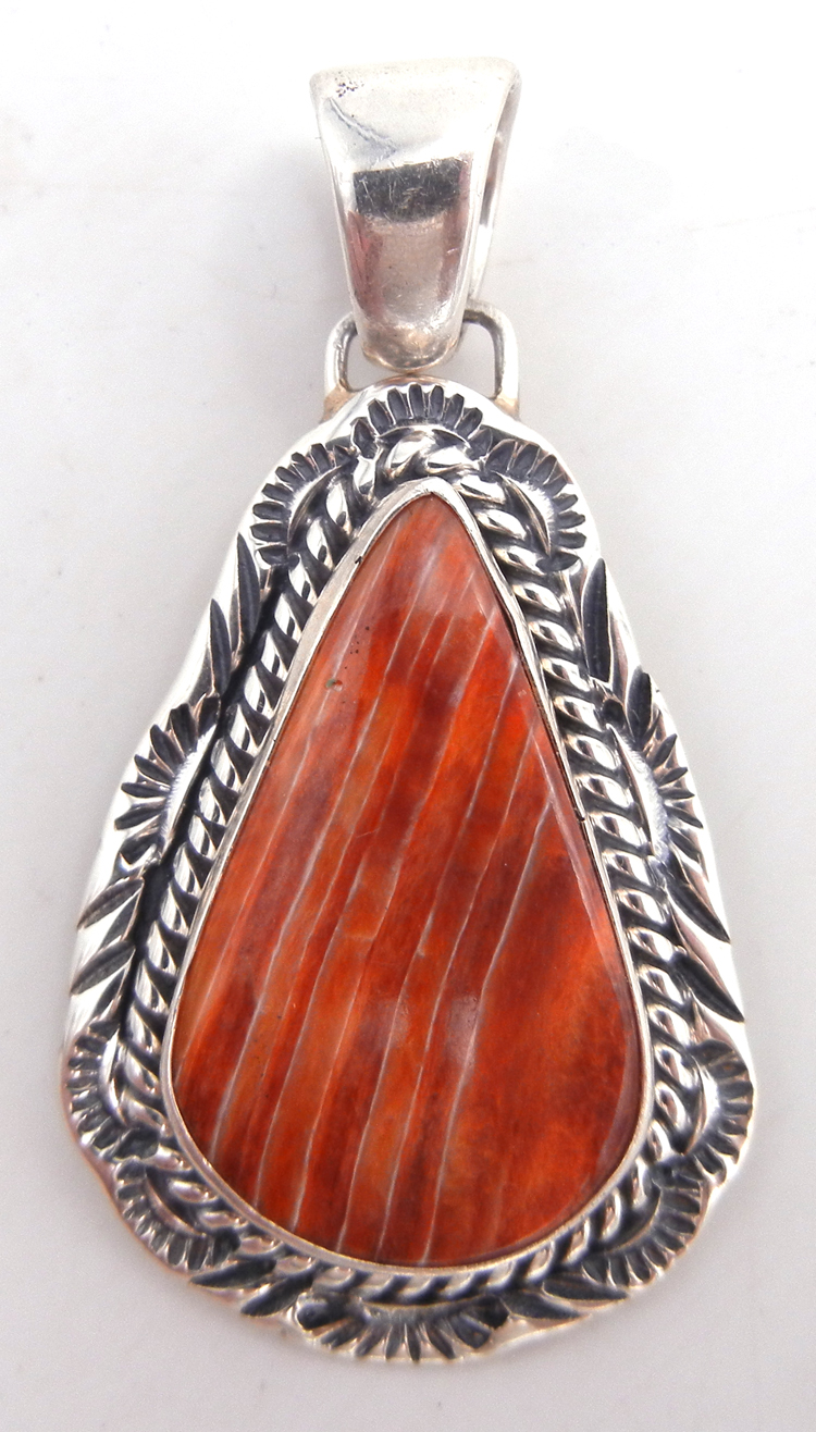 Navajo burnt orange spiny oyster shell and sterling silver pendant