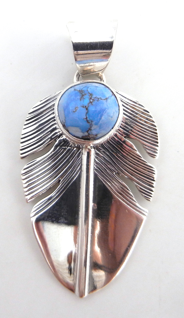 Navajo Golden Hills turquoise and sterling silver feather pendant