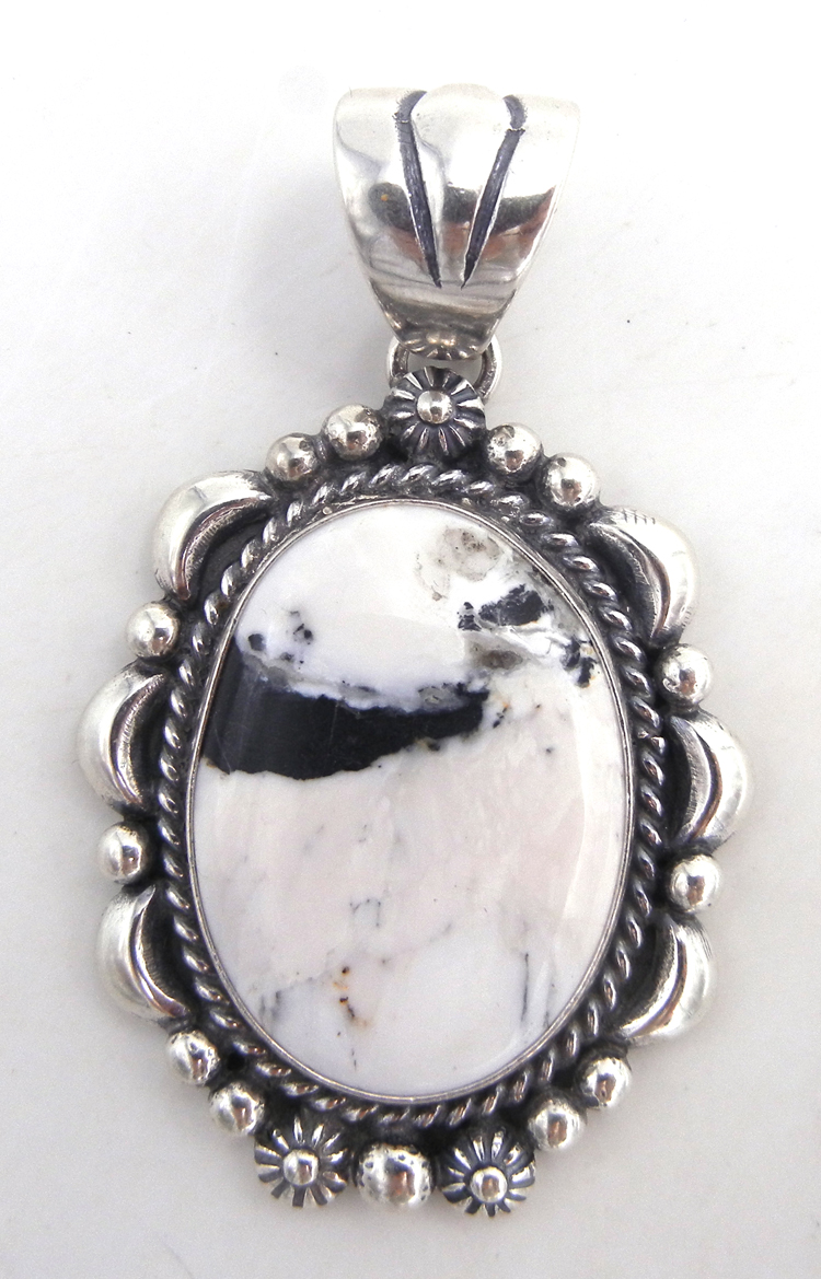 Navajo white buffalo and sterling silver pendant