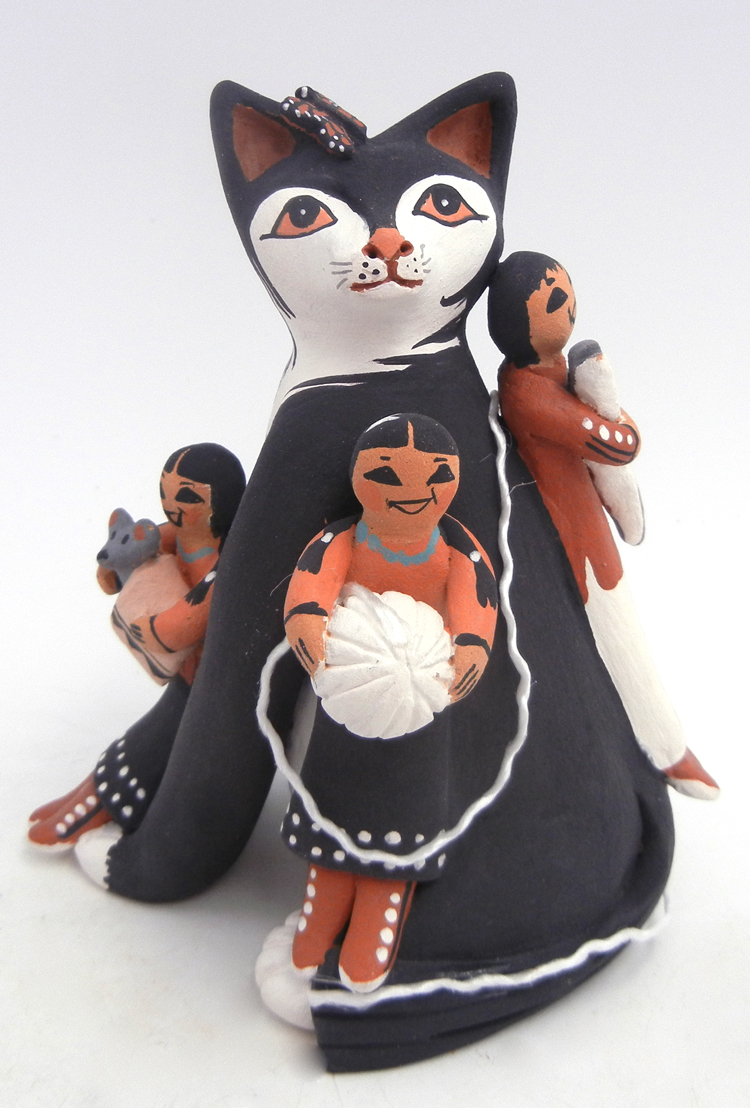 Jemez handmade black cat storyteller figurine with three children, mouse, fish and ball of yarn by Carol Lucero Gachupin
