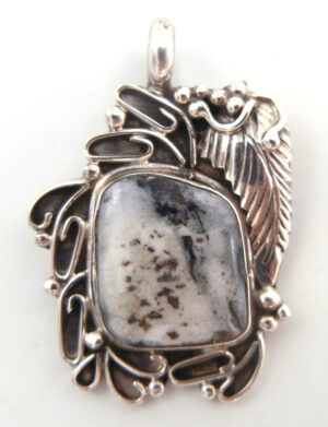 Navajo White Buffalo and sterling silver pendant by Juan Guerro