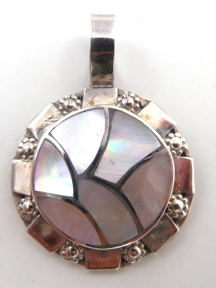 Zuni white mother of pearl and sterling silver inlay pendant by Claudine Haloo