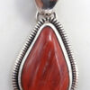Navajo small red spiny oyster shell and sterling silver pendant by Wydell Billie