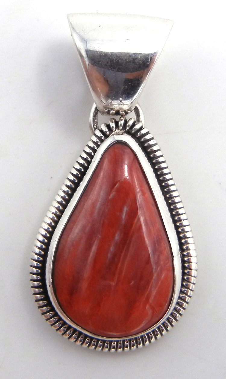 Navajo small red spiny oyster shell and sterling silver pendant by Wydell Billie