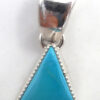 Navajo small triangular turquoise and sterling silver pendant