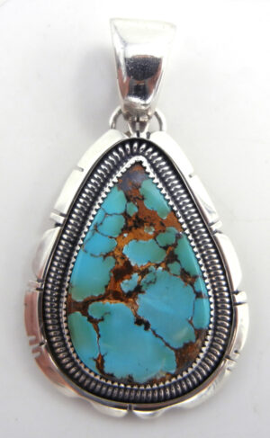 Navajo tear drop shaped turquoise and sterling silver pendant by Wydell Billie