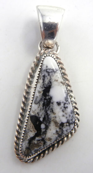 Navajo asymmetrical triangular white buffalo and sterling silver pendant