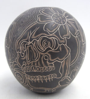 Mata Ortiz handmade and etched black and buff skull and flower design jar by Jose A