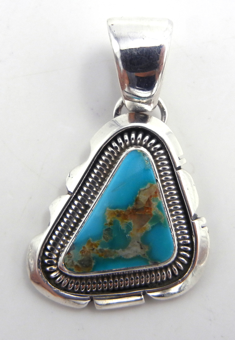 Navajo small turquoise and sterling silver rounded triangular pendant by Wydell Billie