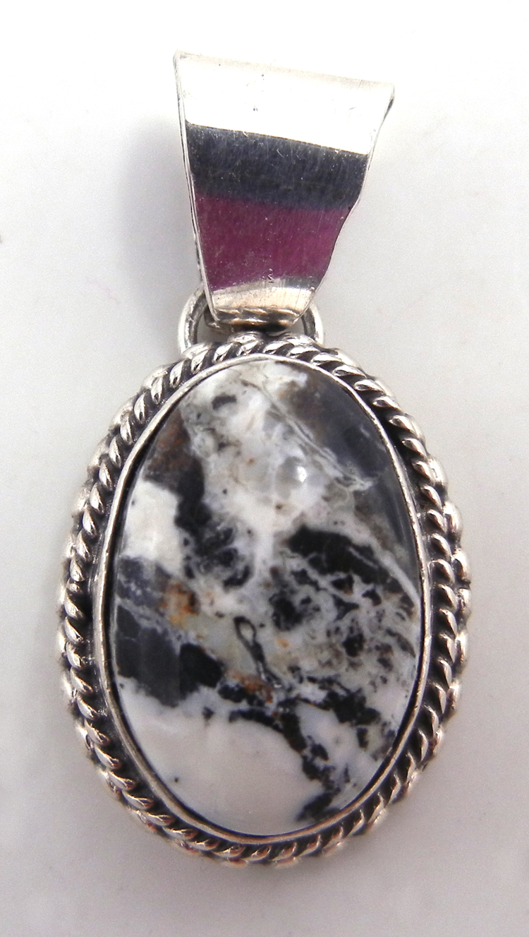 Navajo small white buffalo and sterling silver pendant