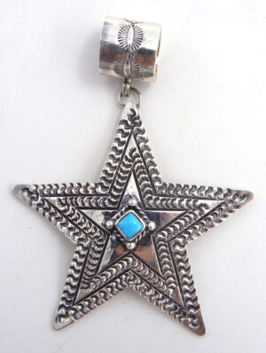 Navajo sterling silver and turquoise star pendant by June Delgarito