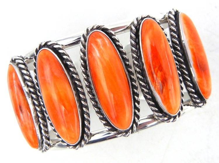 Navajo orange spiny oyster and sterling silver row cuff bracelet by Leonard and Racquel Hurley