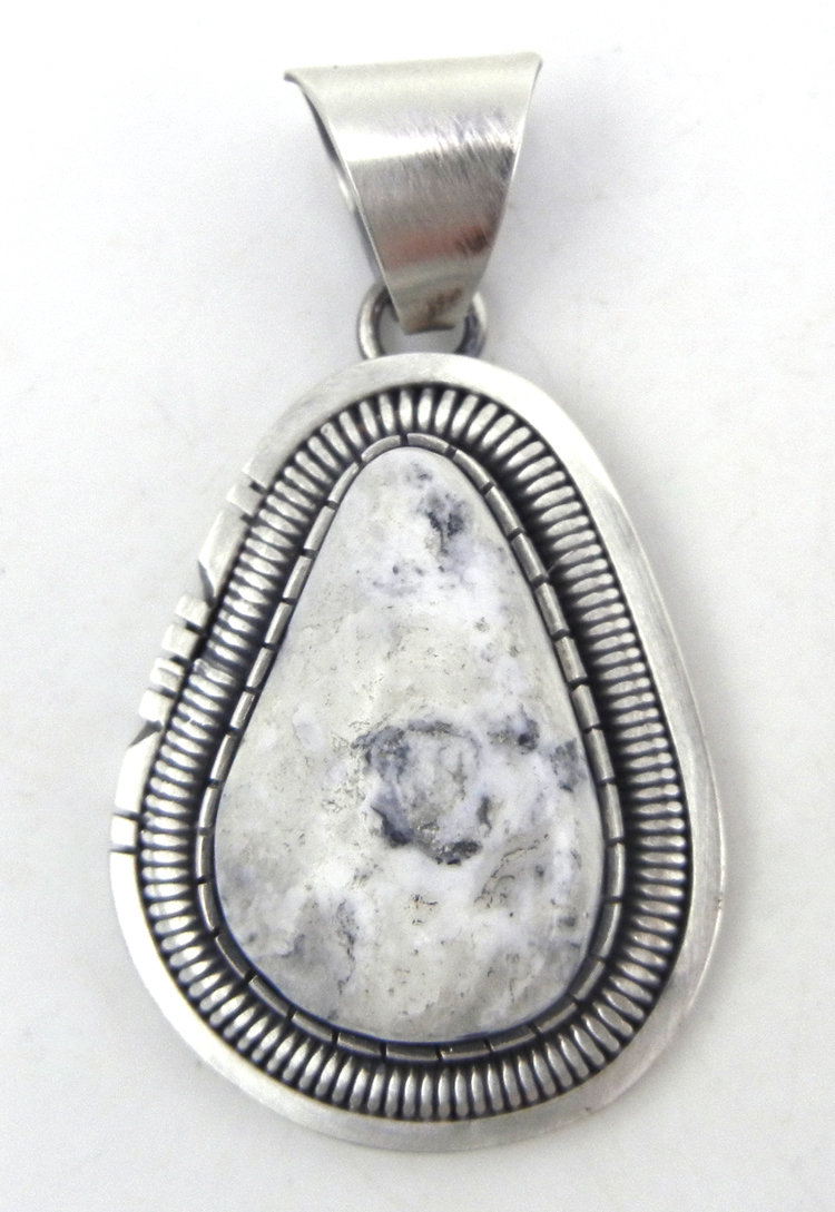 Navajo white buffalo and sterling silver pendant by Walter Vandever