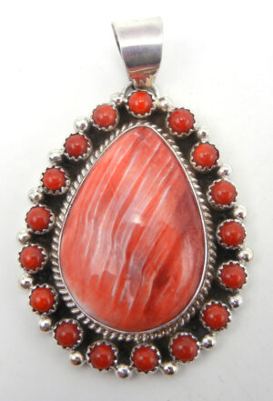 Navajo red spiny oyster shell, coral and sterling silver cluster pendant by Delbert Delgarito