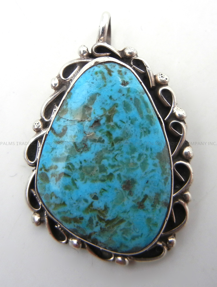 Navajo turquoise and sterling silver pendant by Juan Guerro